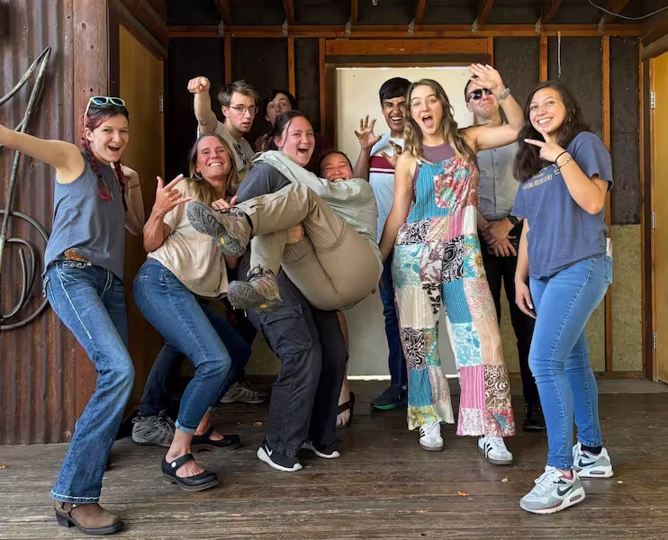 A group of people at the Youth Climate Action event making funny poses